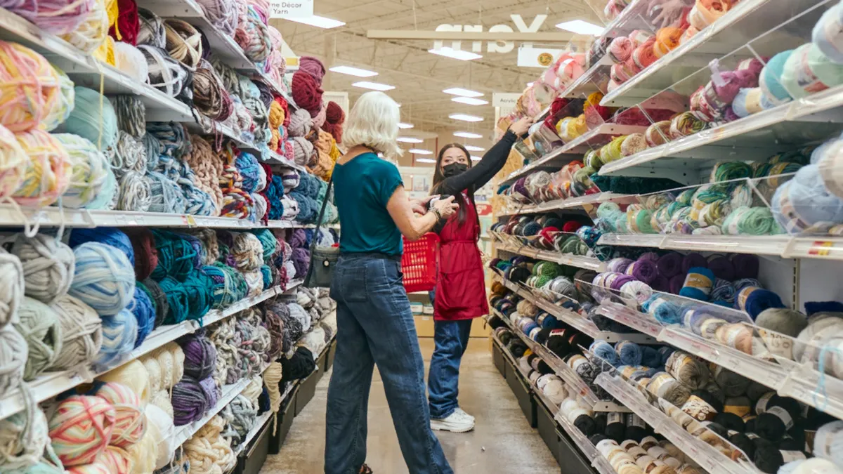 A customer and a Michaels employee in a store aisle